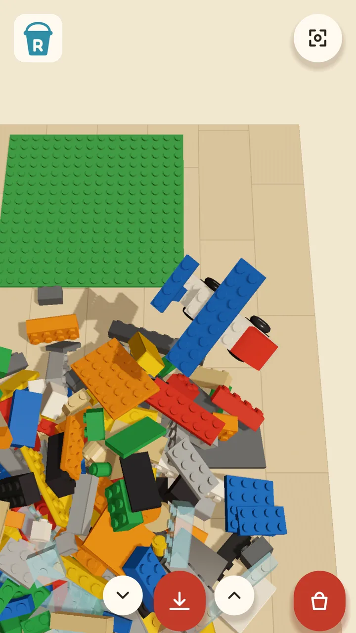 A blue and white brick plane flying low over the pile.