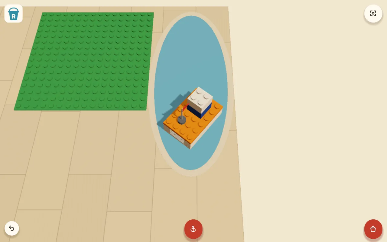 An orange brick boat with a little flag, sailing on a round pond.